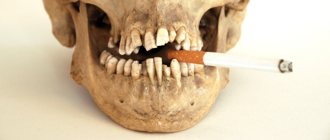 skull smoking cigarette | brandon periodontics